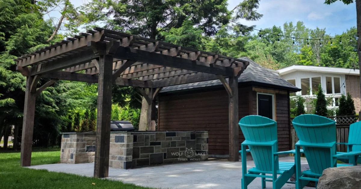 Timber pergola over stone outdoor kitchen